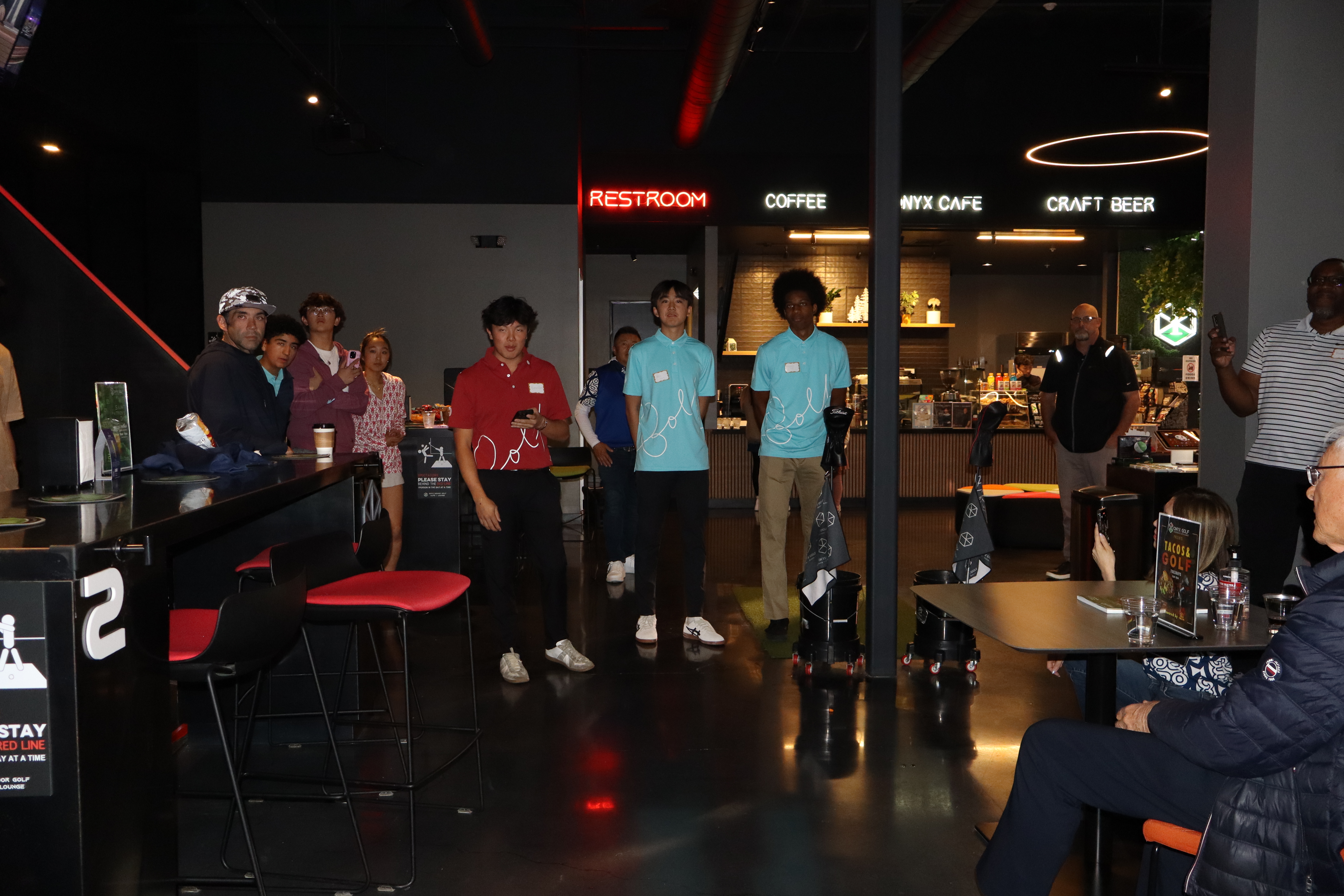 Champion Minds fundraiser night at Onyx Golf, volunteers in GolfNoGolf polos