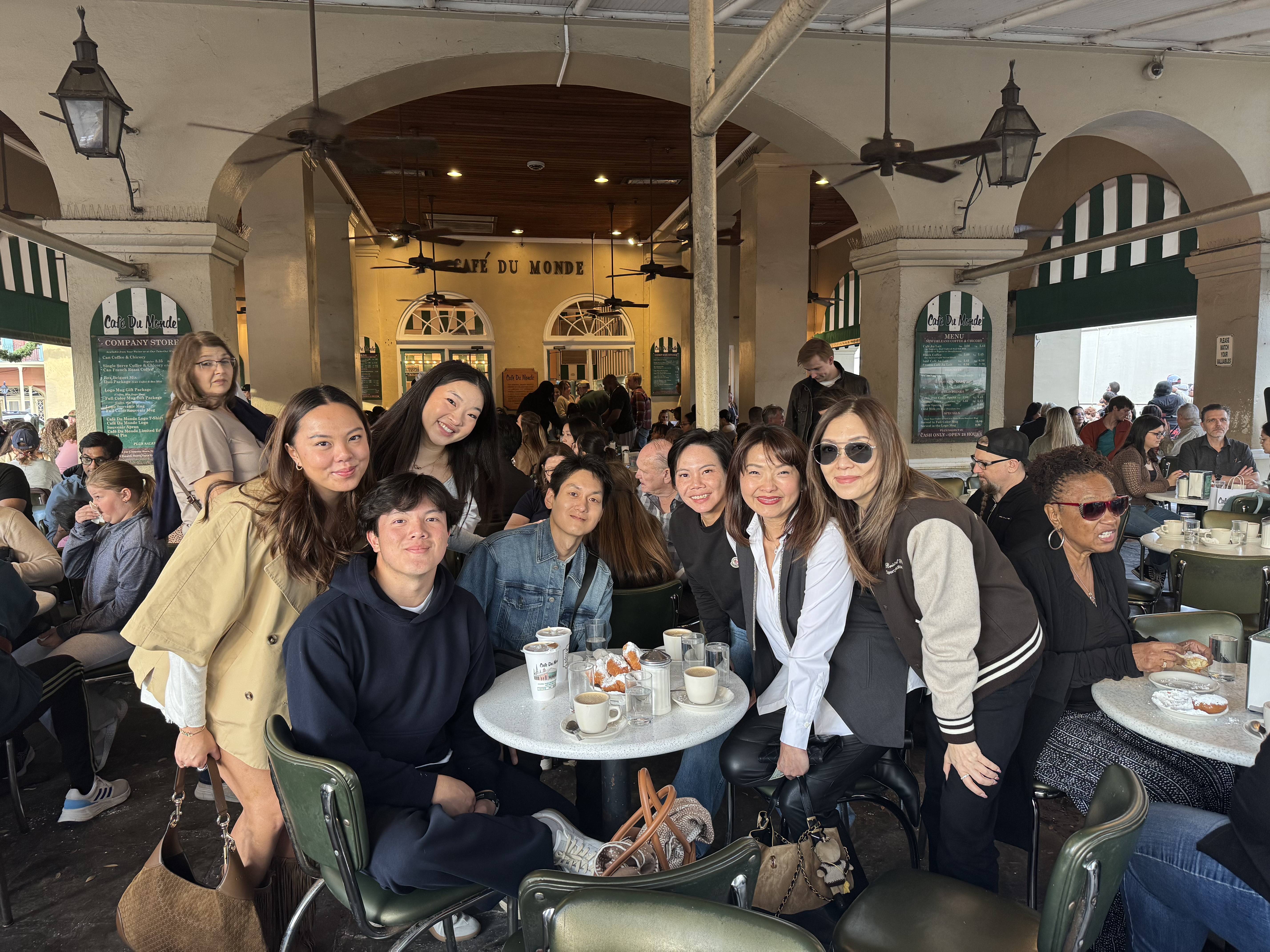 Brandon with family at Café Du Monde in New Orleans