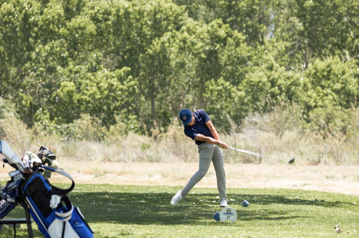 Brandon mid-swing at a tournament tee box