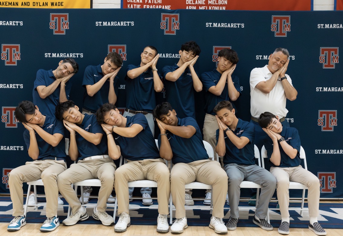 St. Margaret's varsity golf team posing playfully for a team photo